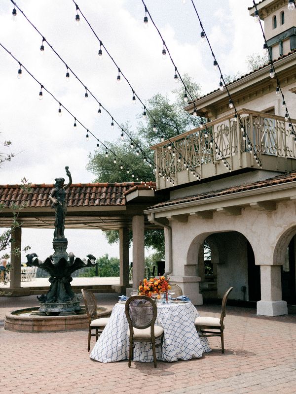 Rica Cobalt tablecloth from Sorrento Sunkiss collection styled for special event dining with elegant place settings