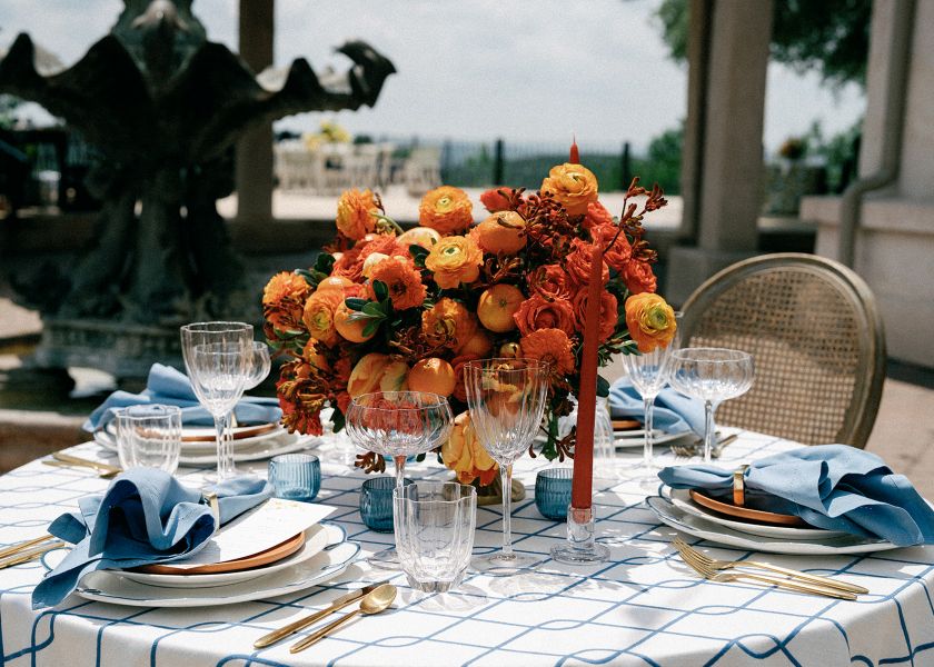 Detail shot of Rica Cobalt tablecloth edge highlighting quality embroidered geometric pattern and premium linen texture