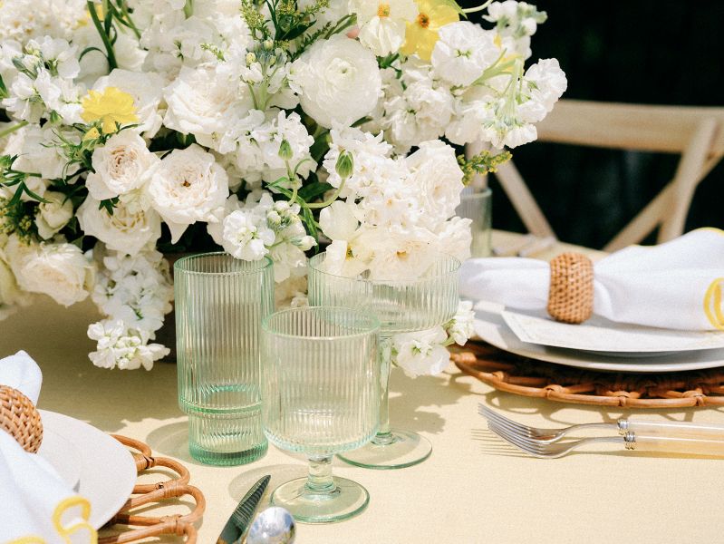 Detail shot of Verona Honey tablecloth highlighting organic slub weave fabric texture and sunlit Mediterranean appeal