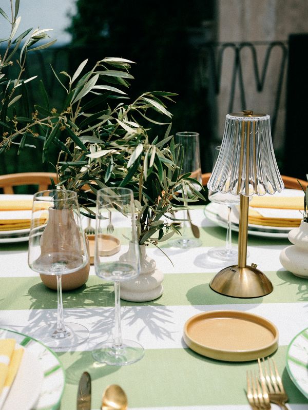 Vintage Stripe Palm linen tablecloth rental displaying timeless green stripe pattern perfect for casual and refined tablescapes
