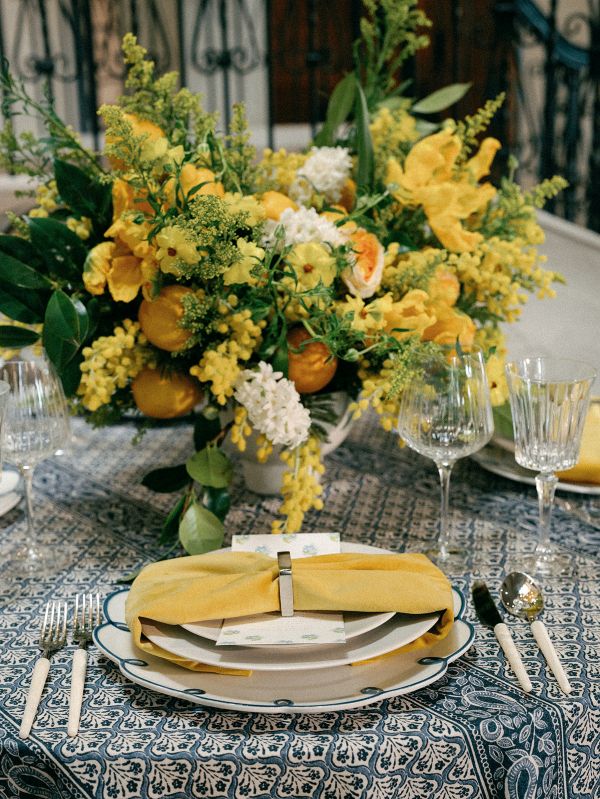 Elegant indigo tablecloth for Amalfi Coast event style with intricate floral and border details