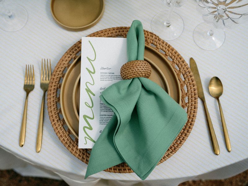Elegant table setting with Ticking Lemon tablecloth rental showcasing refined striped pattern and versatile golden styling