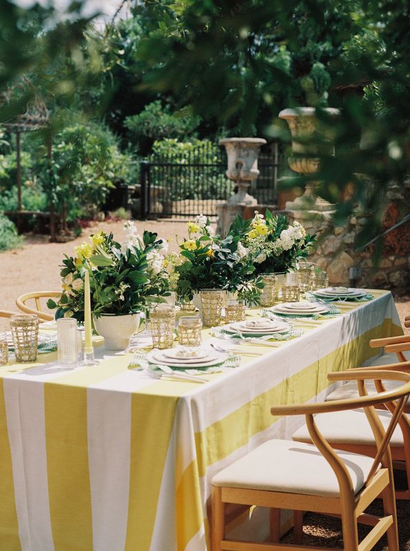 Detail shot of Vintage Stripe Zest tablecloth highlighting bright citrus stripe design inspired by Sicilian lemons and coastal retreats