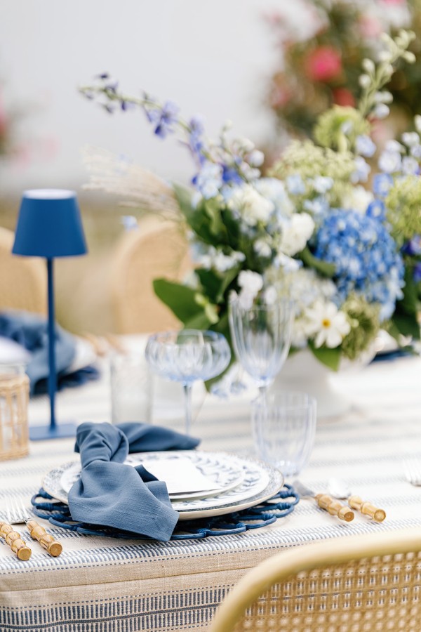 Nautical dinner table styled with navy fabric