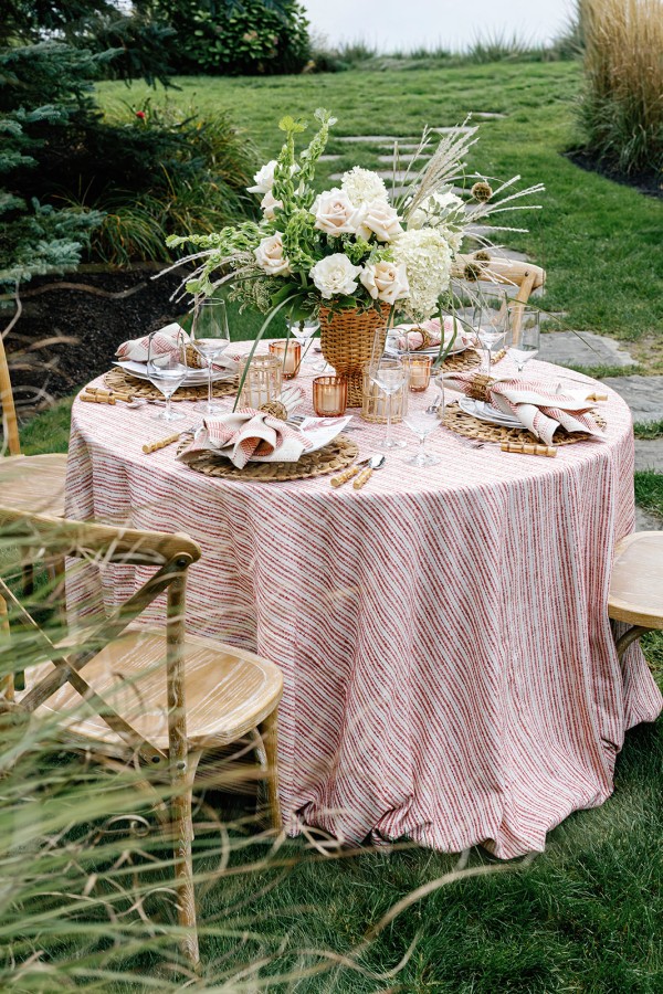 Coastal dinner table styled with Tide Crimson