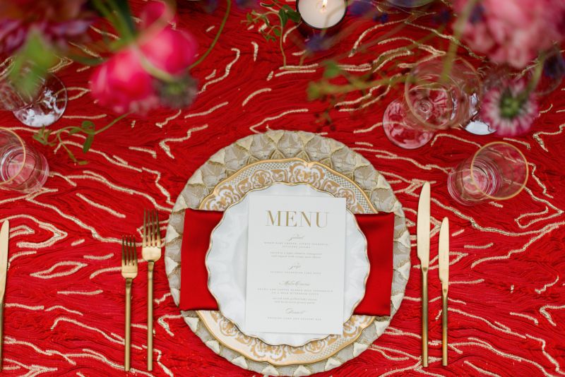 Close-up of Elara Crimson fabric’s molten pattern