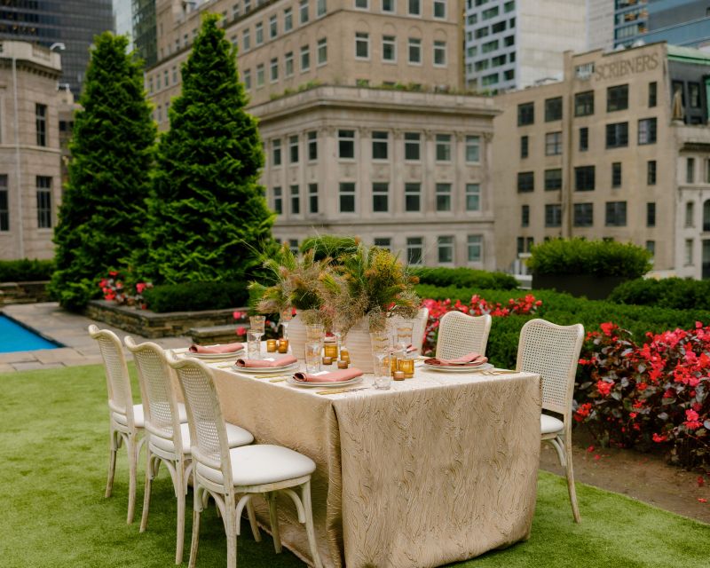 Elegant golden wedding table with organic pattern linen