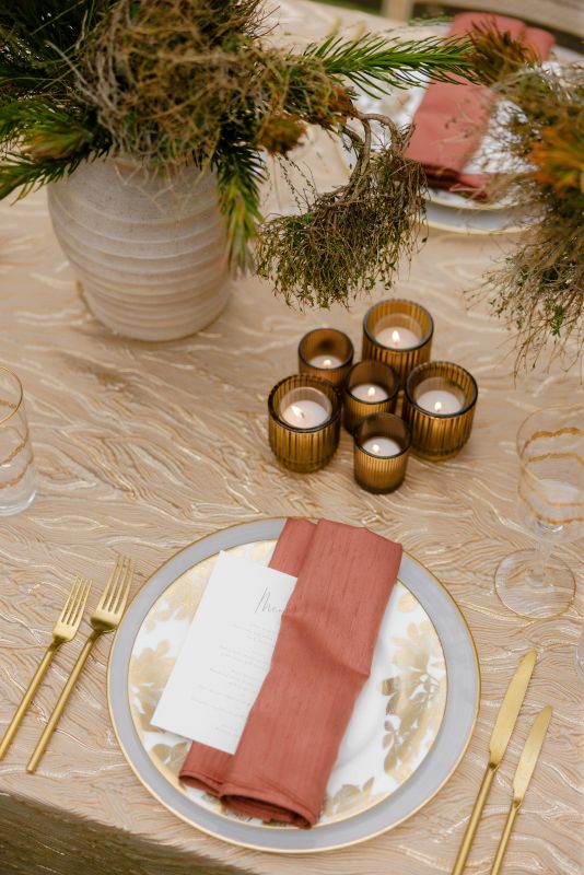 Gold metallic table linen with warm, brushed sheen