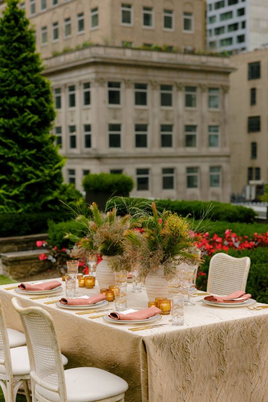 Sophisticated gold table setting for evening event