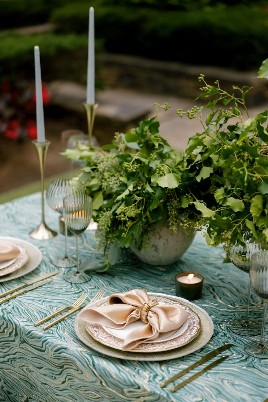 Luxury green event linen with gemstone-like pattern