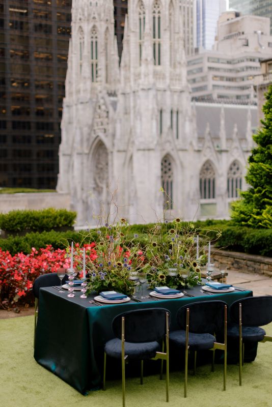 Holiday tablescape in dark green and gold