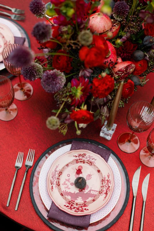 Warm garnet linen paired with classic dinnerware